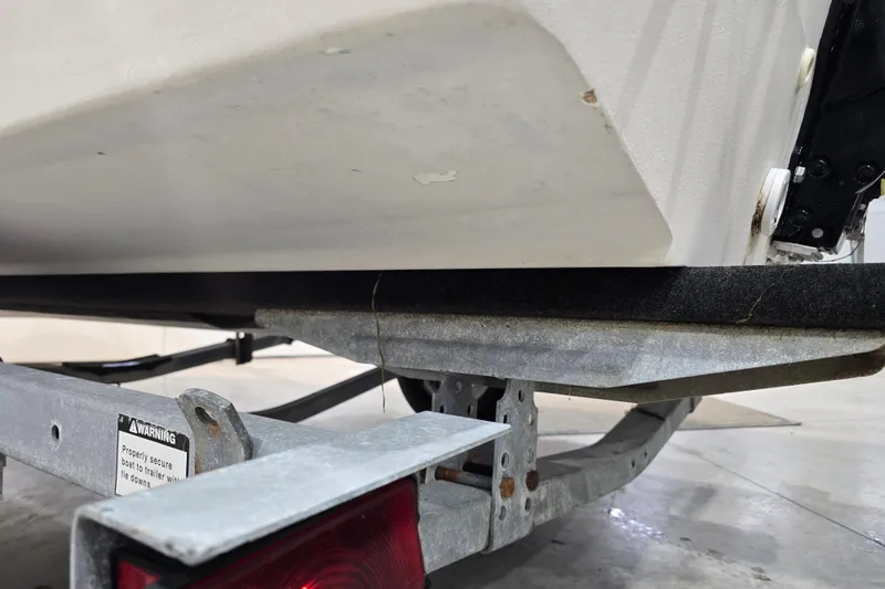 Slide: The Image of 1999 Boston Whaler Dauntless 14 boat on trailer, close-up view. - 37