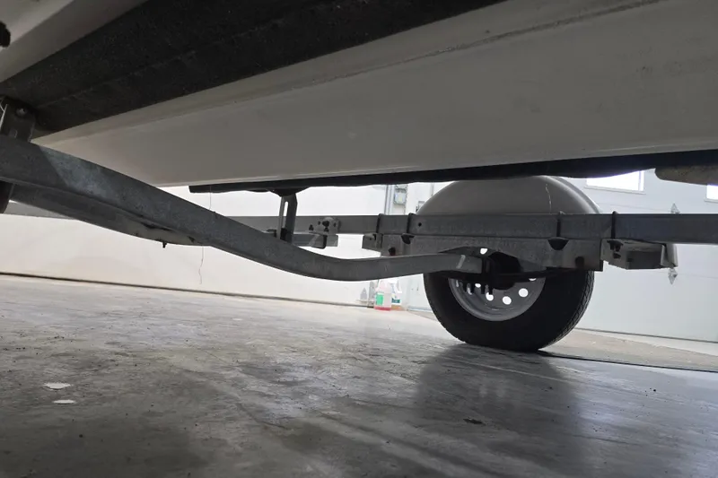 Slide: The Image of Underside view of a 1999 Boston Whaler Dauntless 14 on a trailer. - 38