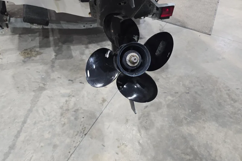 Slide: The Image of Propeller of a 1999 Boston Whaler Dauntless 14 boat on a concrete floor. - 39