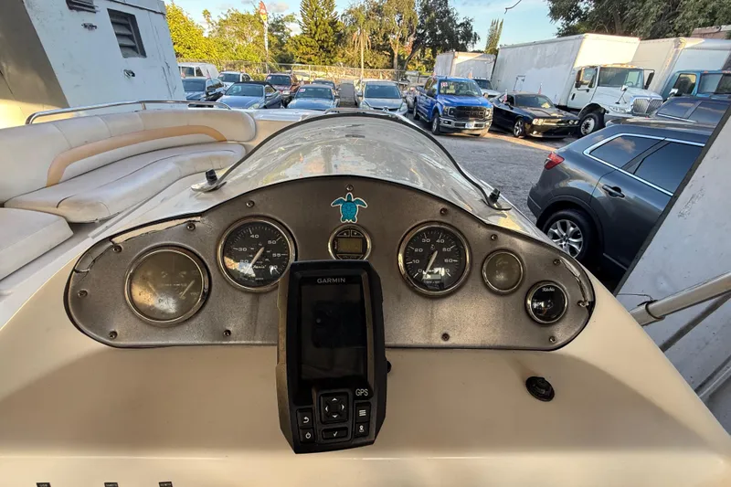 Slide: The Image of 2016 Hurricane SunDeck Sport 232 OB dashboard with gauges and Garmin GPS. - 23