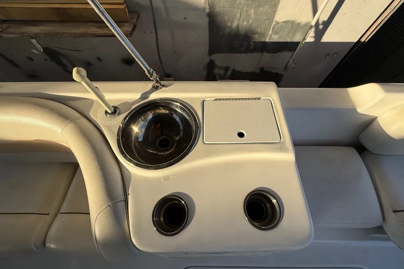 Slide: The Image of 2016 Hurricane SunDeck Sport 232 OB boat interior with sink and cup holders. - 28