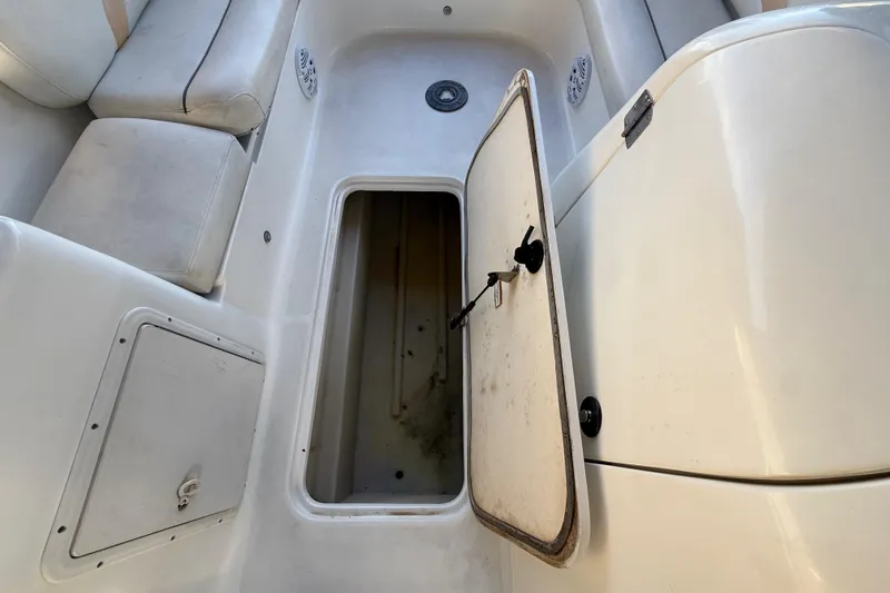 Slide: The Image of 2016 Hurricane SunDeck Sport 232 OB boat interior with open storage compartment. - 31