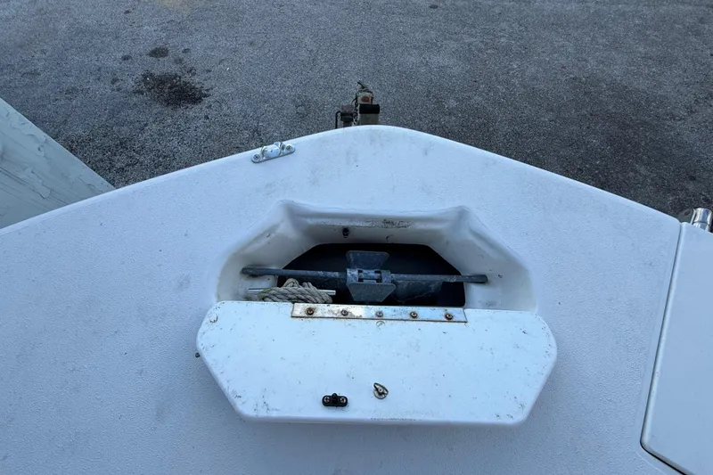 Slide: The Image of 2016 Hurricane SunDeck Sport 232 OB boat anchor storage compartment. - 40