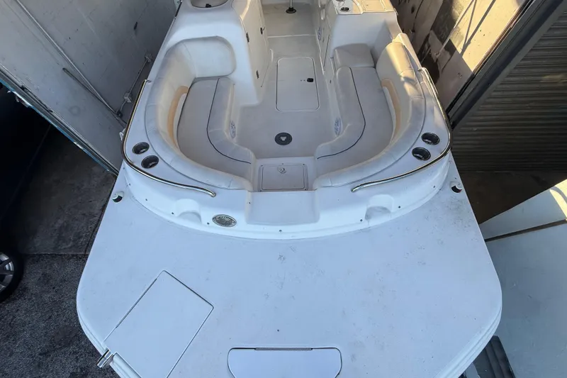 Slide: The Image of 2016 Hurricane SunDeck Sport 232 OB boat interior with spacious seating and cup holders. - 41