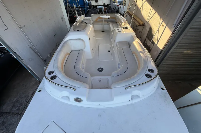 Slide: The Image of 2016 Hurricane SunDeck Sport 232 OB boat interior with spacious seating and cup holders. - 42