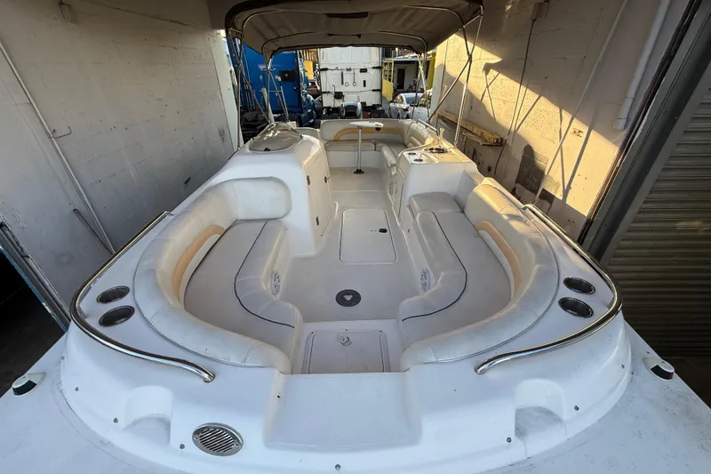 Slide: The Image of 2016 Hurricane SunDeck Sport 232 OB boat interior with spacious seating and cup holders. - 43