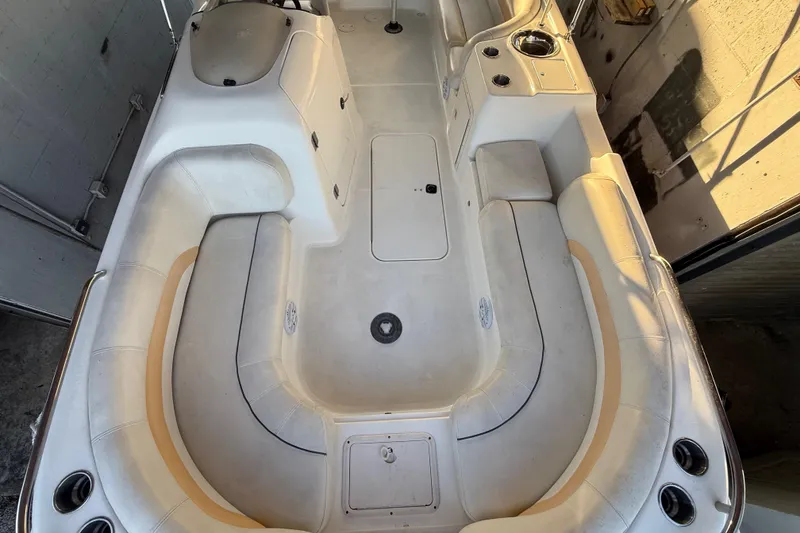 Slide: The Image of 2016 Hurricane SunDeck Sport 232 OB boat interior with spacious seating and storage compartments. - 44