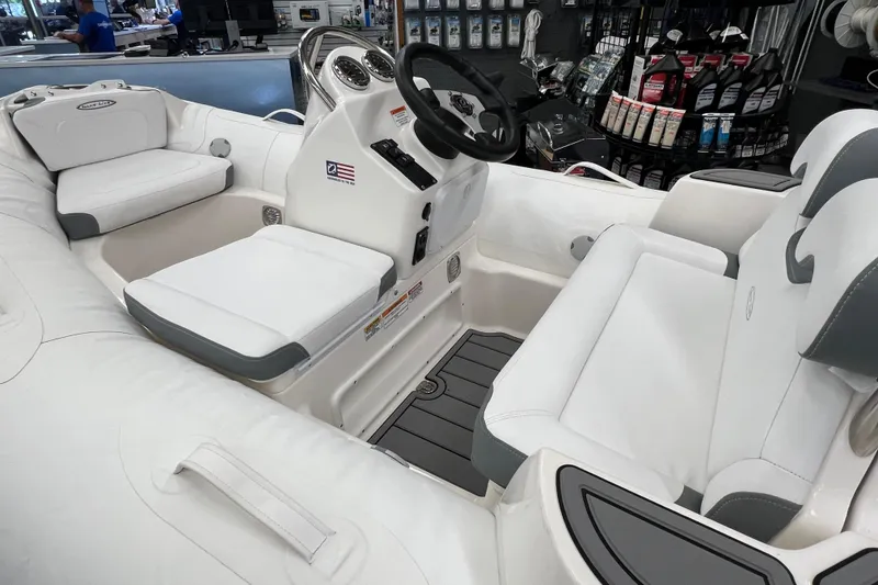 Slide: The Image of 2023 Zodiac Yachtline 360 interior with white seating and modern dashboard. - 4