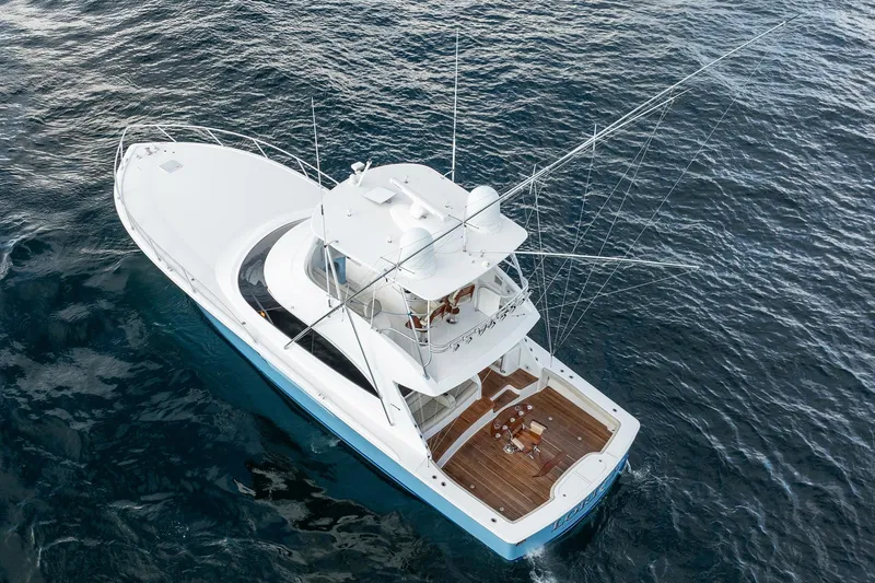 Slide: The Image of Aerial view of 2021 Viking 54 Convertible yacht on open water. - 100