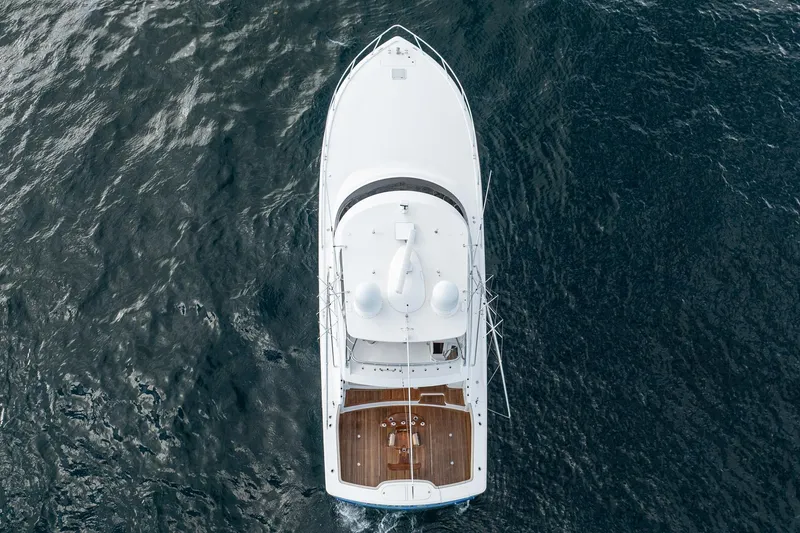 Slide: The Image of Aerial view of 2021 Viking 54 Convertible yacht on open water. - 101