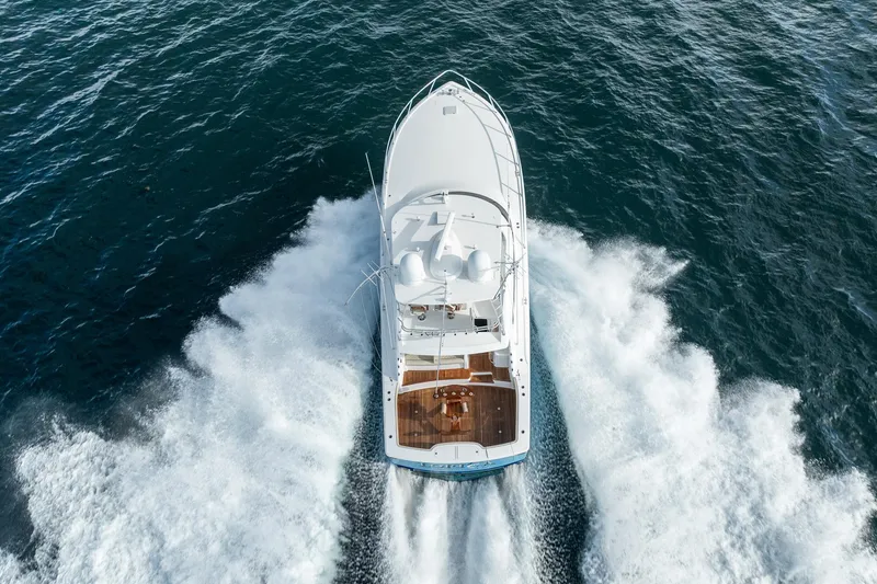 Slide: The Image of Aerial view of 2021 Viking 54 Convertible yacht cruising on open water. - 103