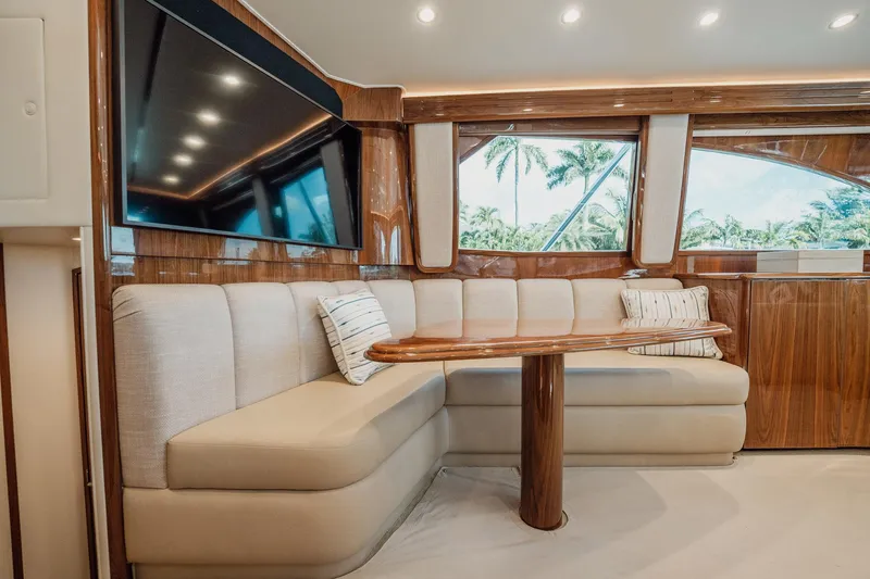Slide: The Image of Luxurious interior of 2021 Viking 54 Convertible yacht with plush seating and elegant wood finishes. - 15