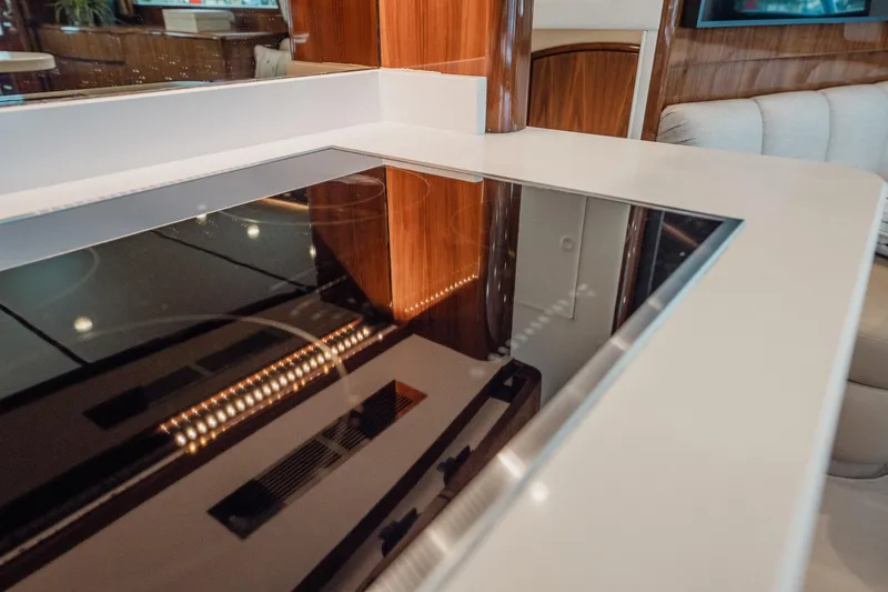 Slide: The Image of Modern kitchen interior of 2021 Viking 54 Convertible yacht with sleek countertop. - 22
