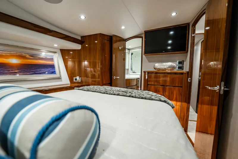 Slide: The Image of Luxurious interior of 2021 Viking 54 Convertible yacht with elegant wood finishes and modern amenities. - 31
