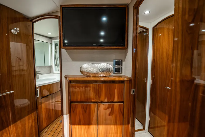 Slide: The Image of Luxurious interior of 2021 Viking 54 Convertible yacht with wood finish and modern amenities. - 32