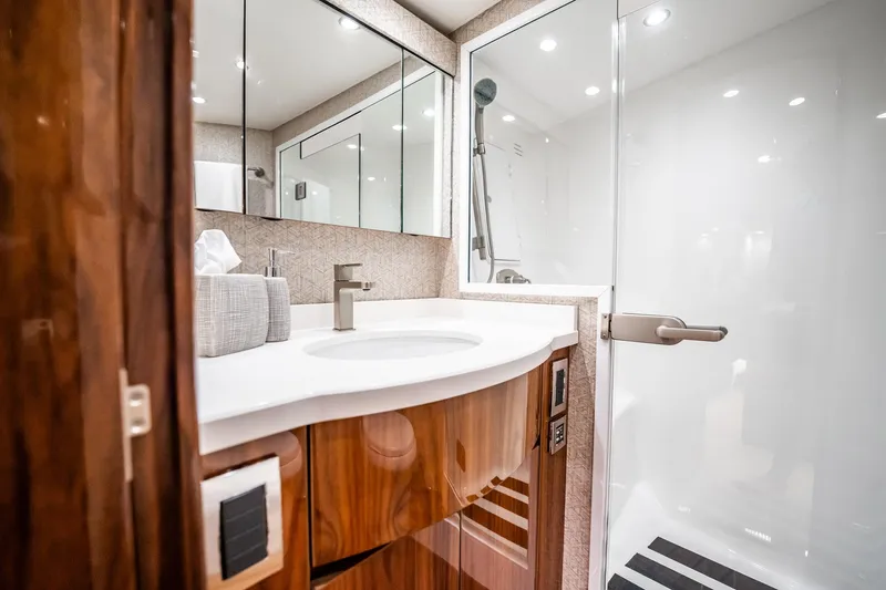 Slide: The Image of Luxurious bathroom in 2021 Viking 54 Convertible yacht with modern fixtures and elegant design. - 33