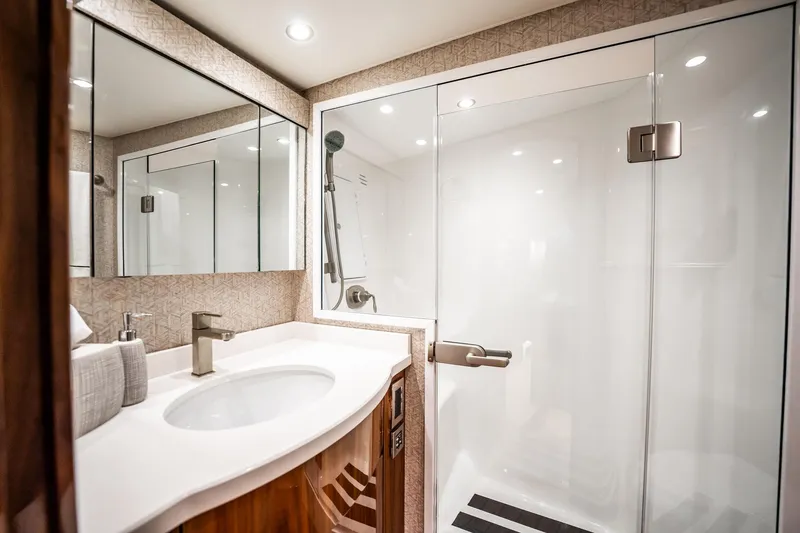 Slide: The Image of Luxurious bathroom in 2021 Viking 54 Convertible yacht with modern fixtures and spacious shower. - 35