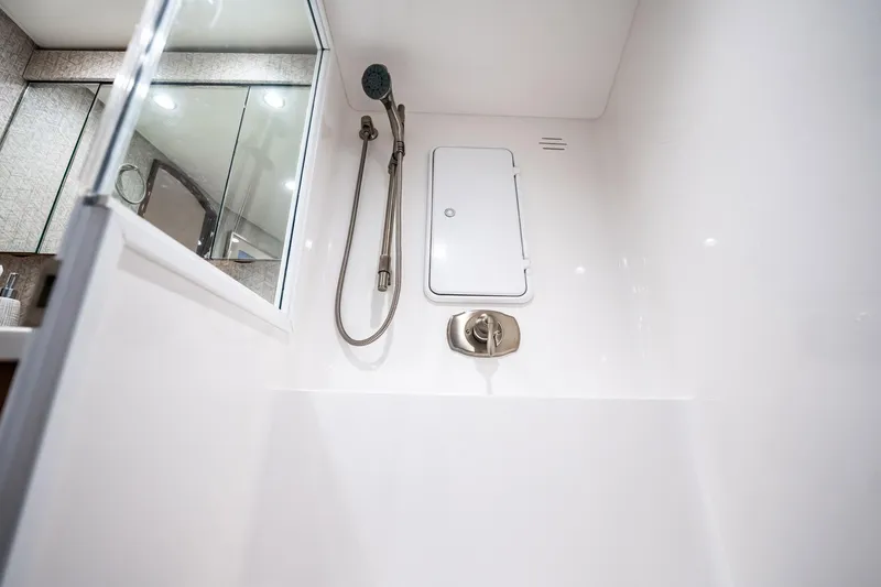 Slide: The Image of Shower area in 2021 Viking 54 Convertible yacht, featuring modern fixtures and sleek design. - 36