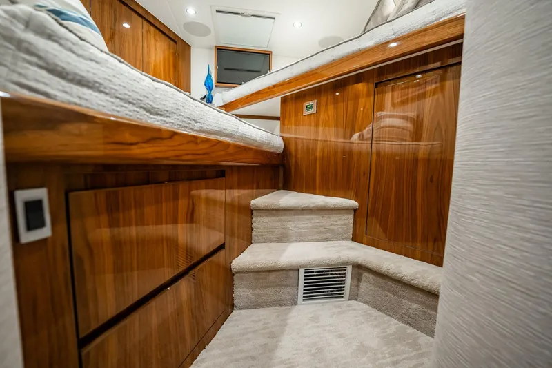 Slide: The Image of Luxurious interior of 2021 Viking 54 Convertible yacht with wooden finish and carpeted steps. - 42