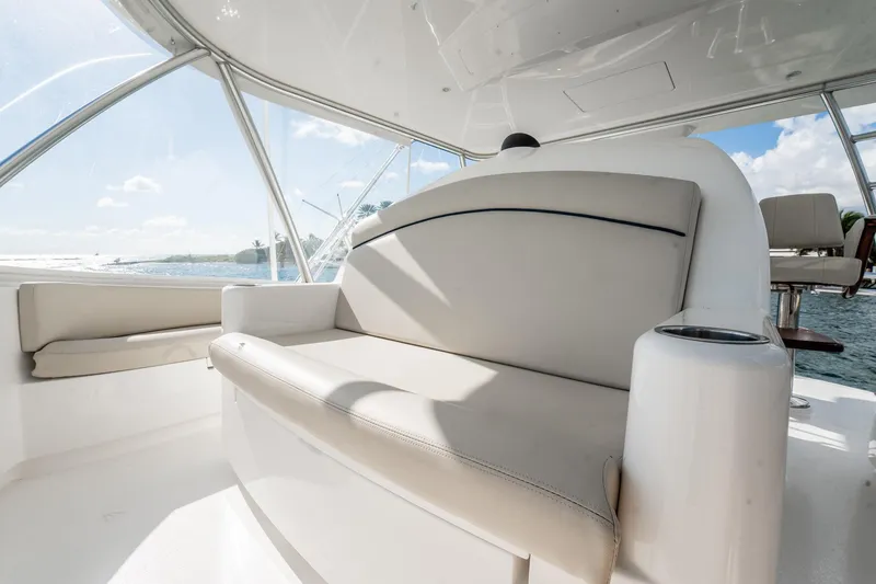 Slide: The Image of Luxurious seating on 2021 Viking 54 Convertible yacht, featuring elegant design and ocean views. - 53