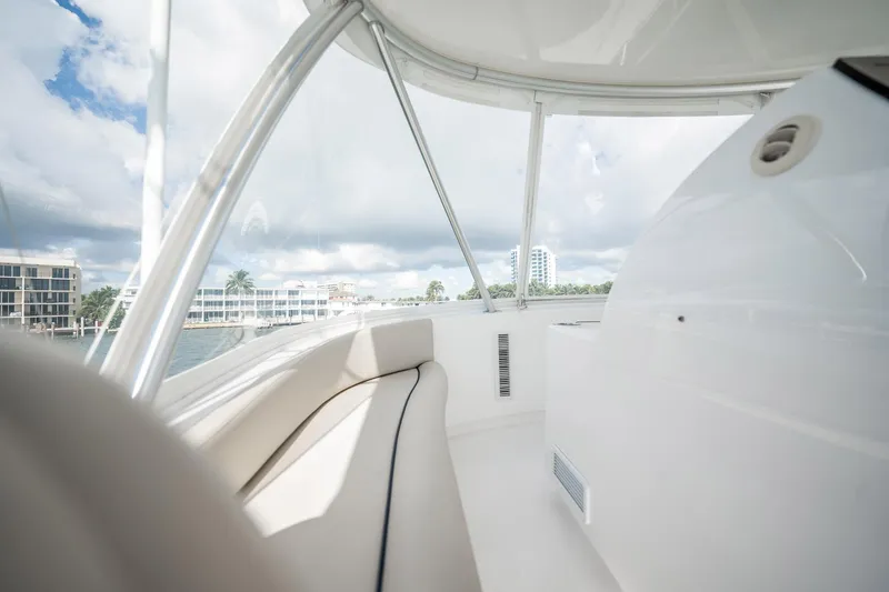 Slide: The Image of Interior view of 2021 Viking 54 Convertible yacht with scenic waterfront backdrop. - 55