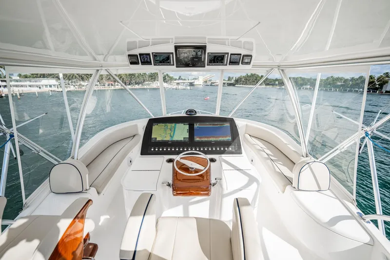 Slide: The Image of Luxurious helm of 2021 Viking 54 Convertible yacht with advanced navigation system. - 57