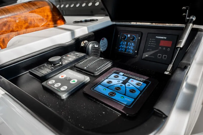 Slide: The Image of Control panel of 2021 Viking 54 Convertible yacht with advanced navigation systems. - 63