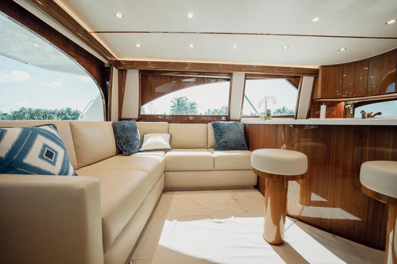 Slide: The Image of Luxurious interior of 2021 Viking 54 Convertible yacht with plush seating and elegant decor. - 7