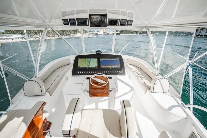Slide: The Image of Luxurious helm of 2021 Viking 54 Convertible yacht with advanced navigation system. - 71
