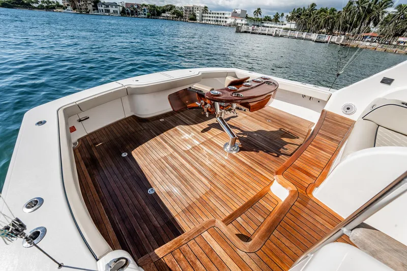 Slide: The Image of Luxurious 2021 Viking 54 Convertible yacht with elegant teak deck and fishing chair. - 79