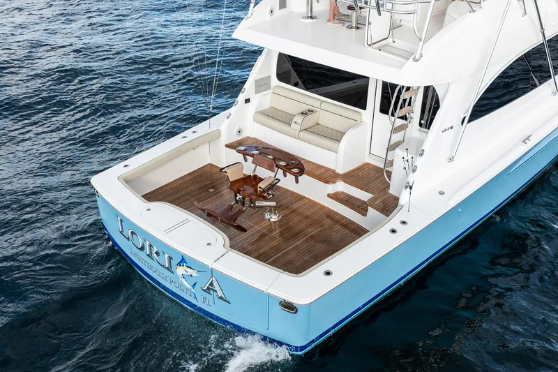 Slide: The Image of 2021 Viking 54 Convertible yacht with spacious deck and elegant design on the water. - 85