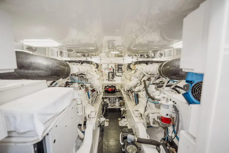 Slide: The Image of Engine room of 2021 Viking 54 Convertible yacht, showcasing dual engines and mechanical systems. - 87