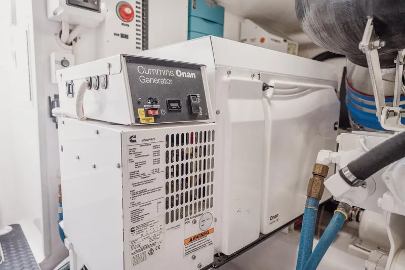 Slide: The Image of Cummins Onan generator in 2021 Viking 54 Convertible yacht engine room. - 94