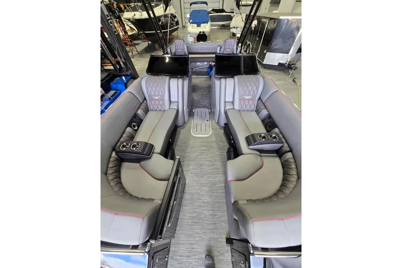 Slide: The Image of Luxurious interior of 2023 Bennington QX 25 QXSBWA pontoon boat with plush seating. - 8