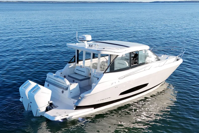 The Image of 2026 Regal 36 XO luxury boat on calm blue water. - 0
