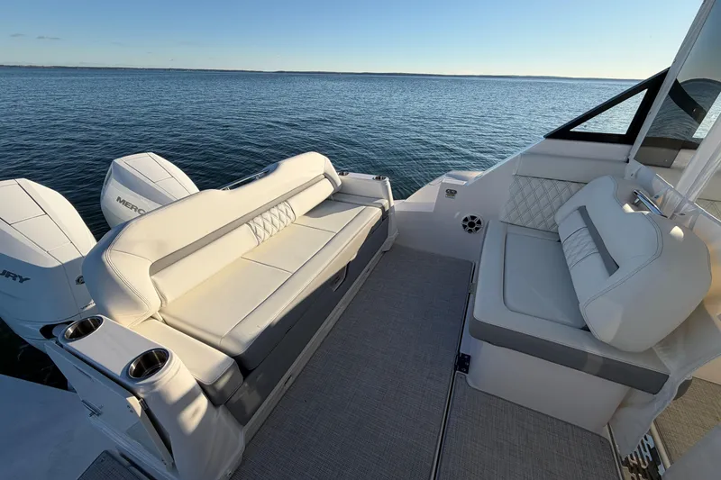 Slide: The Image of 2026 Regal 36 XO boat interior with luxurious seating and Mercury engines on open water. - 14