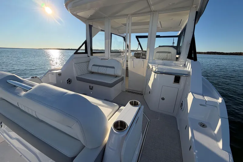Slide: The Image of Luxurious 2026 Regal 36 XO boat interior with seating, on a sunny day at sea. - 17