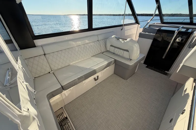 Slide: The Image of Luxurious interior of 2026 Regal 36 XO yacht with elegant seating and panoramic windows. - 19