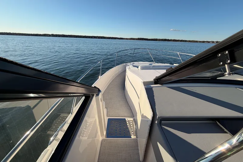 Slide: The Image of 2026 Regal 36 XO yacht deck with scenic water view. - 25