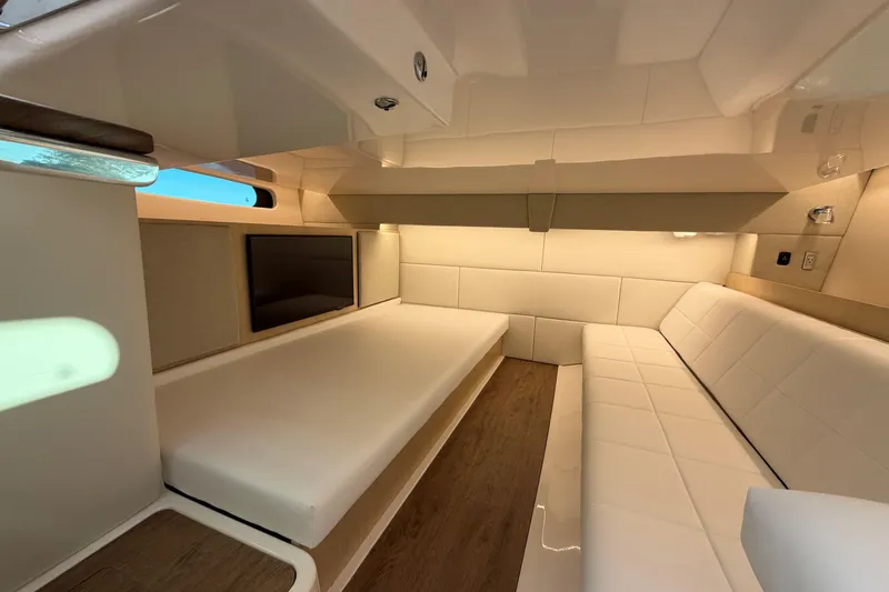 Slide: The Image of Luxurious interior of 2026 Regal 36 XO yacht with modern seating and ambient lighting. - 35