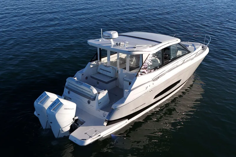 Slide: The Image of 2026 Regal 36 XO luxury boat on calm water, featuring twin outboard engines. - 5