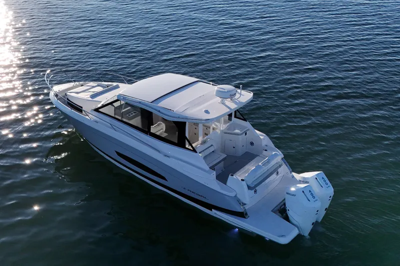 Slide: The Image of 2026 Regal 36 XO boat on calm water, showcasing sleek design and modern features. - 8