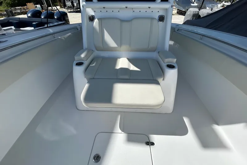 Slide: The Image of 2022 Cape Horn 36 boat interior with cushioned seating and cup holders. - 10