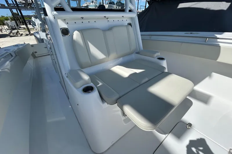 Slide: The Image of 2022 Cape Horn 36 boat interior with cushioned seating and cup holders. - 11