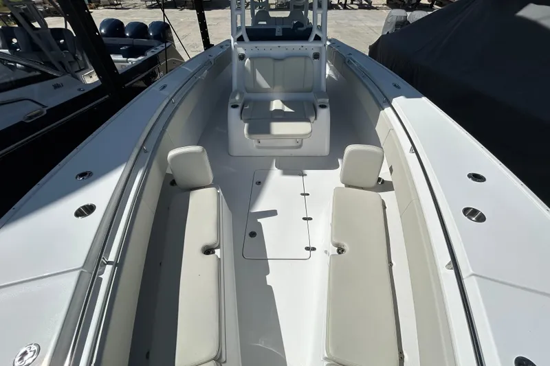 Slide: The Image of 2022 Cape Horn 36 boat interior with white seating and spacious deck layout. - 12