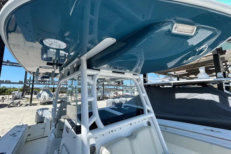 Slide: The Image of 2022 Cape Horn 36 boat with sleek blue canopy and modern design. - 17