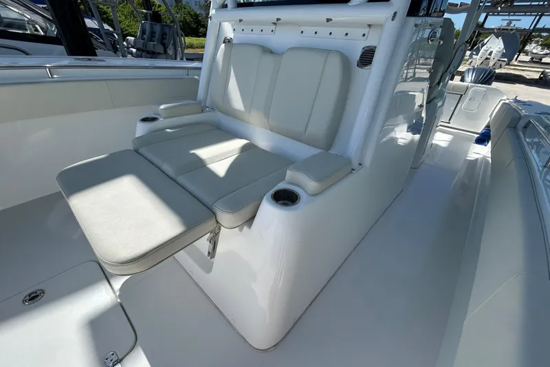 Slide: The Image of 2022 Cape Horn 36 boat interior with cushioned seating and cup holders. - 18