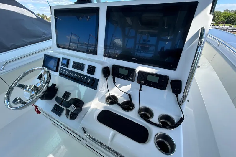 Slide: The Image of 2022 Cape Horn 36 boat dashboard with dual screens and control panel. - 25