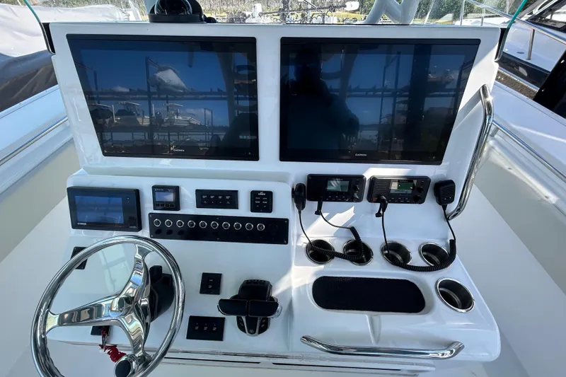 Slide: The Image of 2022 Cape Horn 36 boat dashboard with dual Garmin displays and steering wheel. - 27