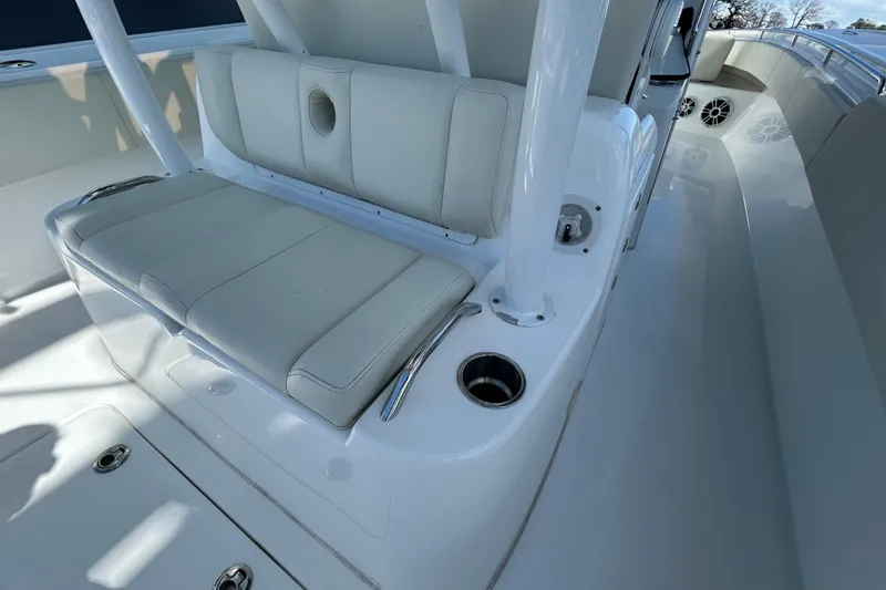 Slide: The Image of 2022 Cape Horn 36 boat interior with cushioned seating and cup holders. - 33
